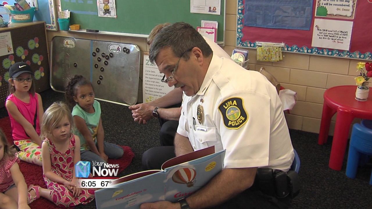 Local police chiefs read to students to emphasize the important of early education 2.jpg